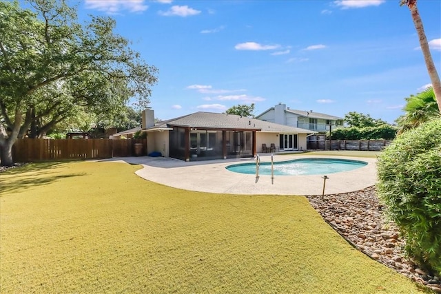 5241 Saint Andrews Dr, Corpus Christi, TX 78413 - view of swimming pool with a sunroom, a fenced backyard, and a patio