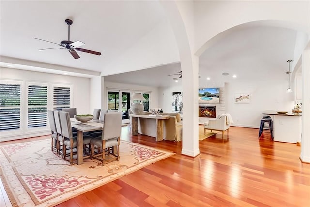 5241 Saint Andrews Dr, Corpus Christi, TX 78413 - dining room featuring a ceiling fan, light wood-style flooring, arched walkways, vaulted ceiling, and recessed lighting
