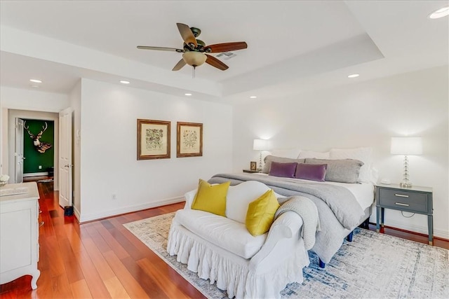 5241 Saint Andrews Dr, Corpus Christi, TX 78413 - bedroom with a raised ceiling, wood finished floors, recessed lighting, baseboards, and a ceiling fan