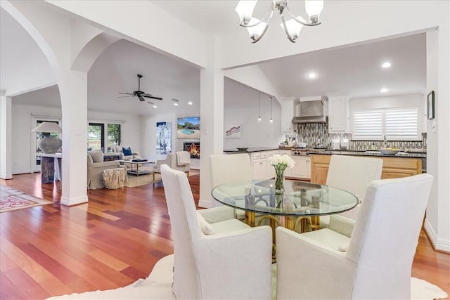 5241 Saint Andrews Dr, Corpus Christi, TX 78413 - dining space featuring a chandelier, light wood-style flooring, a ceiling fan, vaulted ceiling, and recessed lighting