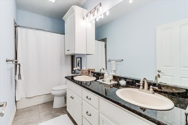 5241 Saint Andrews Dr, Corpus Christi, TX 78413 - bathroom featuring double vanity, toilet, and tile patterned floors