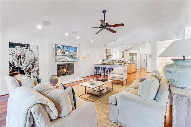 5241 Saint Andrews Dr, Corpus Christi, TX 78413 - living area with a ceiling fan, a fireplace, light wood-type flooring, recessed lighting, and high vaulted ceiling