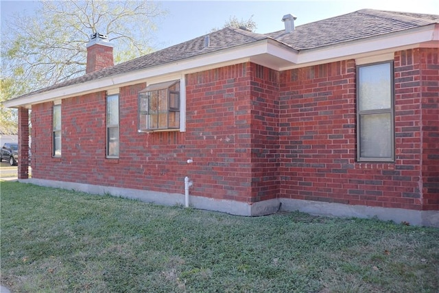 view of property exterior with a lawn