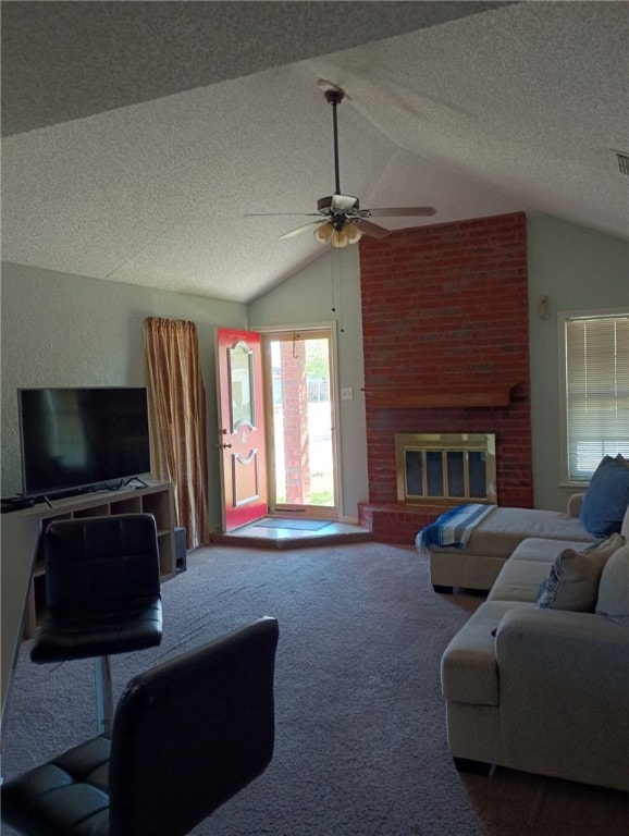 living room featuring a fireplace, lofted ceiling, carpet, ceiling fan, and a textured ceiling