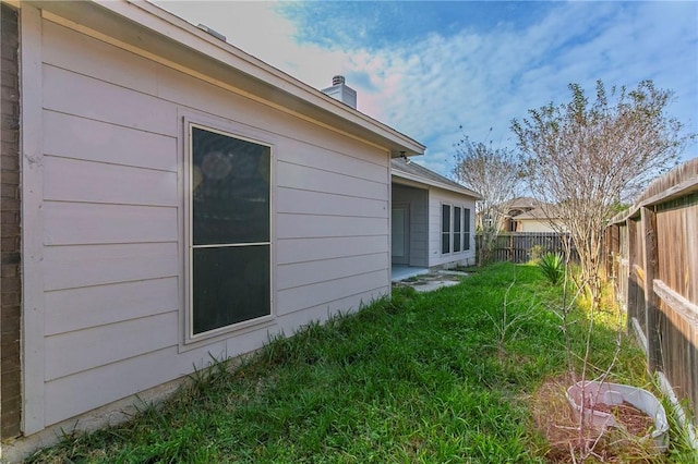 view of home's exterior featuring a yard