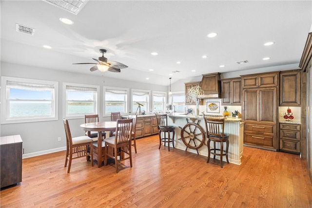 110 Bayshore Dr, Ingleside, TX 78362 - dining room featuring ceiling fan, recessed lighting, plenty of natural light, and light wood-style floors