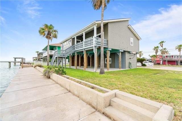 110 Bayshore Dr, Ingleside, TX 78362 - rear view of house with a yard and a deck