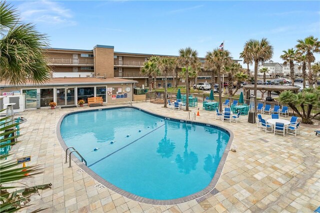 view of pool featuring a patio