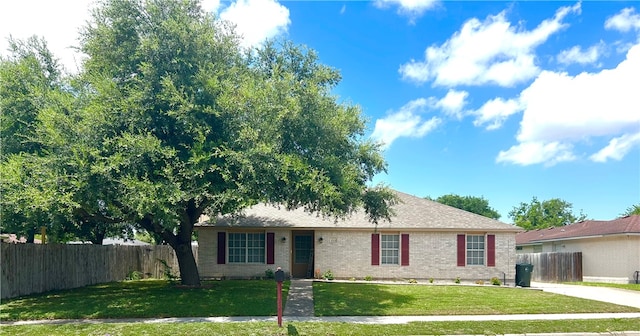 ranch-style house with a front lawn