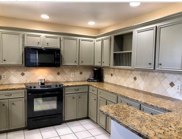 kitchen featuring black appliances, backsplash, light tile patterned floors, and light stone countertops