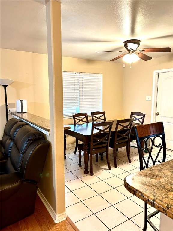 dining area featuring light hardwood / wood-style floors and ceiling fan