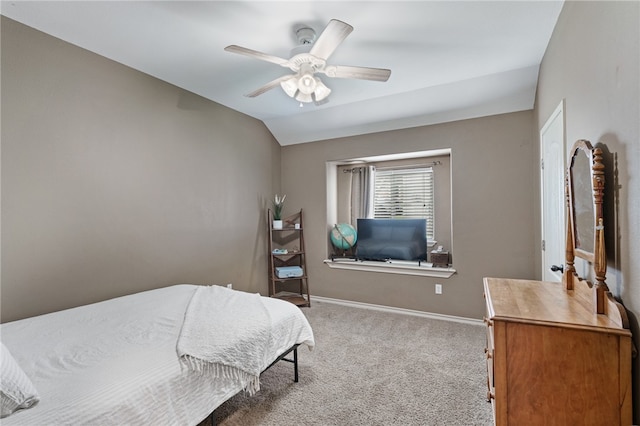 bedroom featuring vaulted ceiling, light carpet, and ceiling fan