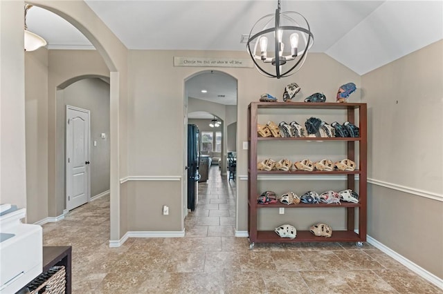 10813 Julianna Dr, Corpus Christi, TX 78410 - corridor featuring arched walkways, a chandelier, and baseboards