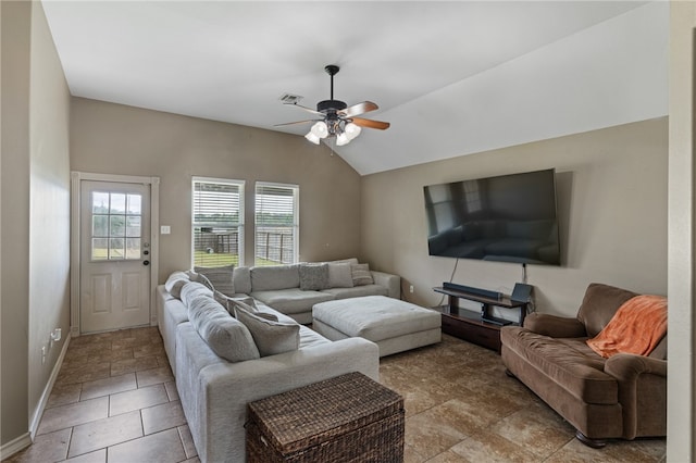 living room featuring vaulted ceiling, light tile patterned floors, and ceiling fan