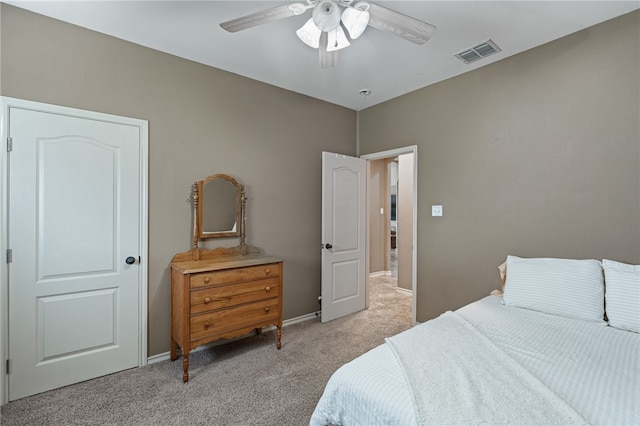 bedroom featuring light colored carpet and ceiling fan