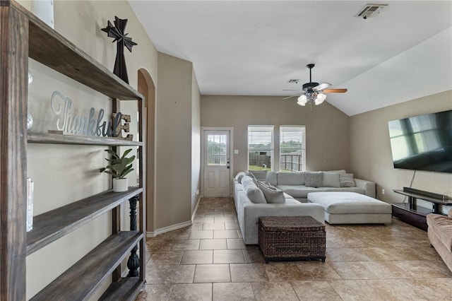 10813 Julianna Dr, Corpus Christi, TX 78410 - living room featuring ceiling fan, vaulted ceiling, baseboards, and stone finish flooring