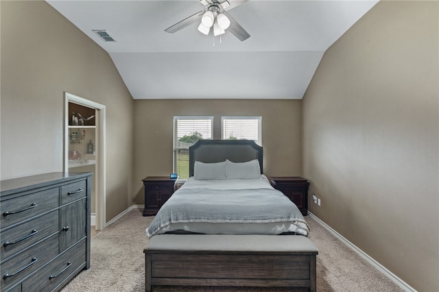 carpeted bedroom featuring lofted ceiling and ceiling fan