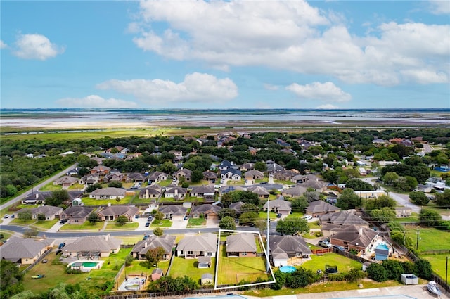 bird's eye view with a water view and a view of the beach