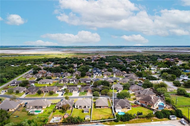 10813 Julianna Dr, Corpus Christi, TX 78410 - aerial perspective of suburban area with property boundaries highlighted and a large body of water
