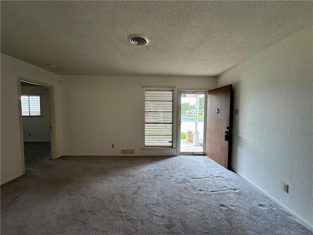 1662 Spicewood Dr, Corpus Christi, TX 78412 - spare room featuring a wealth of natural light, carpet flooring, and visible vents
