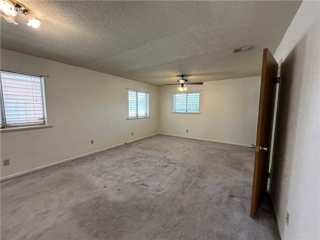 1662 Spicewood Dr, Corpus Christi, TX 78412 - spare room featuring carpet flooring, a textured ceiling, baseboards, visible vents, and ceiling fan
