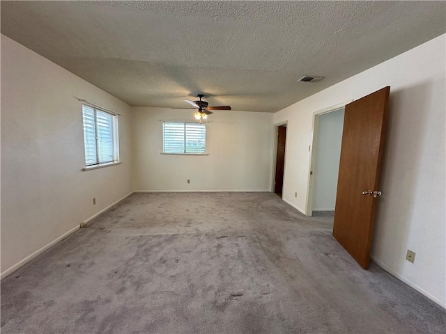 1662 Spicewood Dr, Corpus Christi, TX 78412 - carpeted empty room with a textured ceiling, a ceiling fan, baseboards, and visible vents