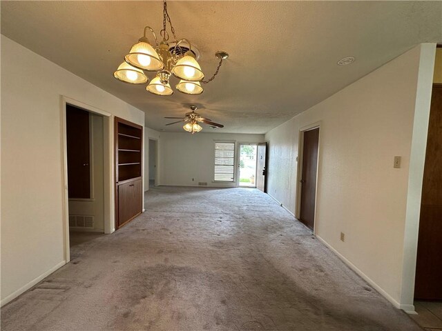 1662 Spicewood Dr, Corpus Christi, TX 78412 - empty room with ceiling fan with notable chandelier, light carpet, baseboards, and visible vents