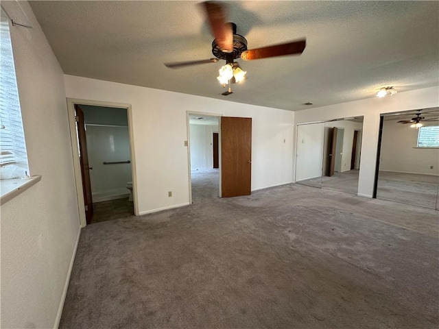 1662 Spicewood Dr, Corpus Christi, TX 78412 - unfurnished bedroom featuring ensuite bath, multiple closets, carpet flooring, and a textured ceiling