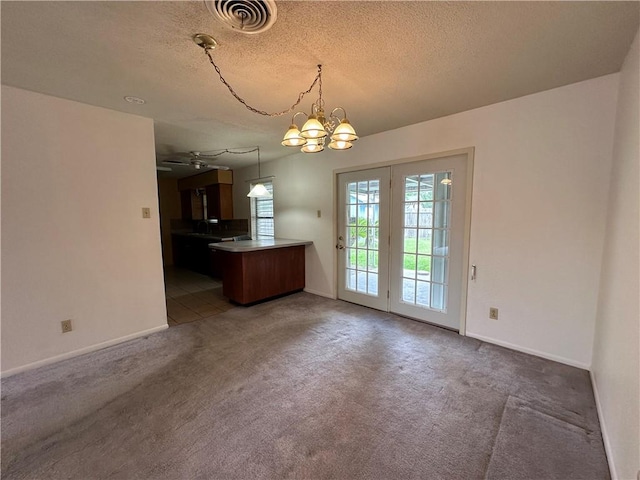 1662 Spicewood Dr, Corpus Christi, TX 78412 - unfurnished dining area featuring carpet floors, a textured ceiling, visible vents, and baseboards