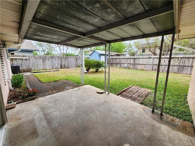 1662 Spicewood Dr, Corpus Christi, TX 78412 - view of patio / terrace featuring a fenced backyard, an outbuilding, and a shed
