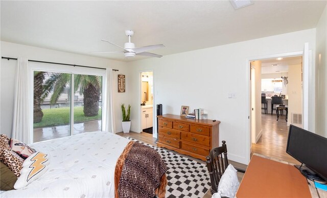 bedroom with a spacious closet, a closet, light hardwood / wood-style floors, and ceiling fan