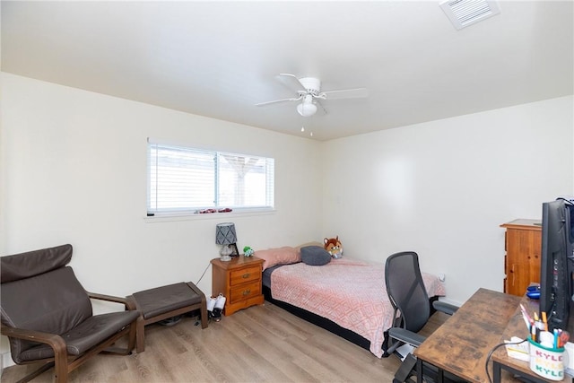 bedroom featuring light wood-type flooring and ceiling fan