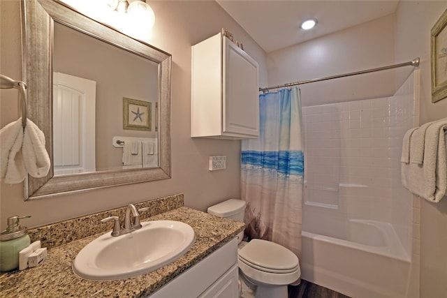 full bathroom featuring vanity, toilet, and shower / bath combo with shower curtain