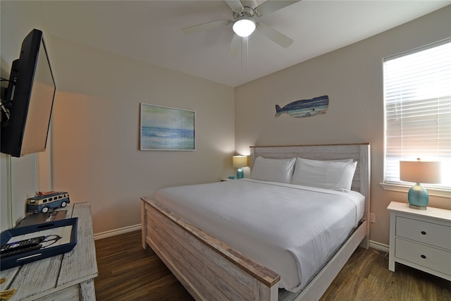 bedroom featuring ceiling fan and dark hardwood / wood-style flooring