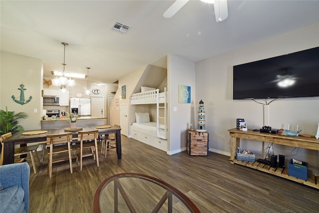 interior space featuring ceiling fan and dark wood-type flooring