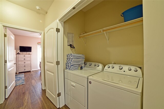 clothes washing area with independent washer and dryer and dark hardwood / wood-style floors