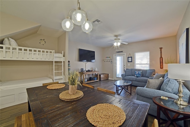 living room featuring ceiling fan and dark hardwood / wood-style flooring