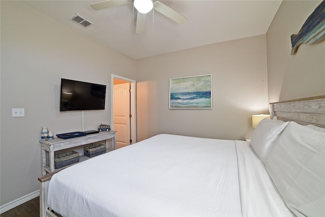 bedroom with ceiling fan and dark wood-type flooring