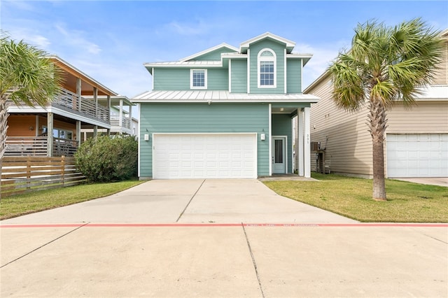 view of front of property with a front lawn and a garage