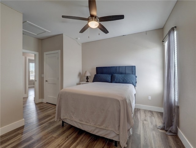 bedroom featuring ceiling fan and hardwood / wood-style flooring