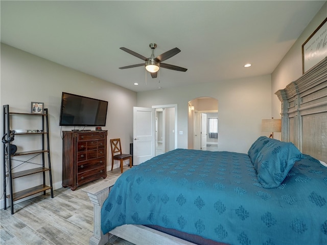 bedroom with light hardwood / wood-style flooring and ceiling fan