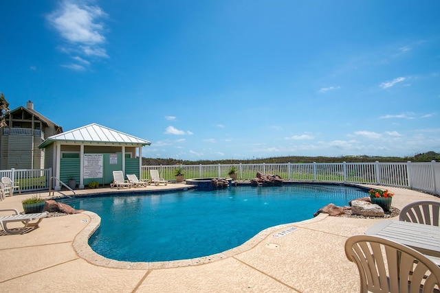 view of pool featuring a patio area