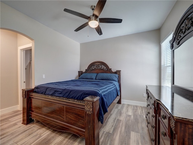 bedroom with ceiling fan and light hardwood / wood-style flooring