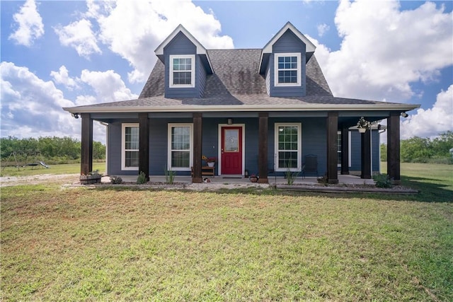 11766 Fm 70, Robstown, TX 78380 - view of front of home with covered porch, a front yard, and a shingled roof