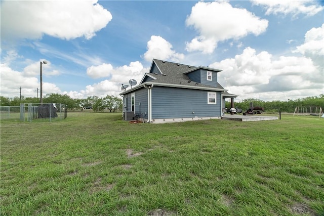 11766 Fm 70, Robstown, TX 78380 - view of side of home featuring a patio area and roof with shingles