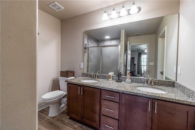 11766 Fm 70, Robstown, TX 78380 - full bath featuring double vanity, wood finished floors, and a stall shower