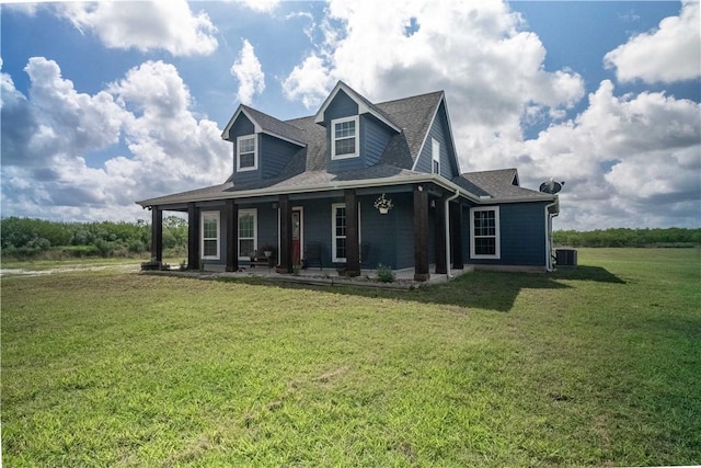 11766 Fm 70, Robstown, TX 78380 - farmhouse inspired home with covered porch, a front lawn, and roof with shingles