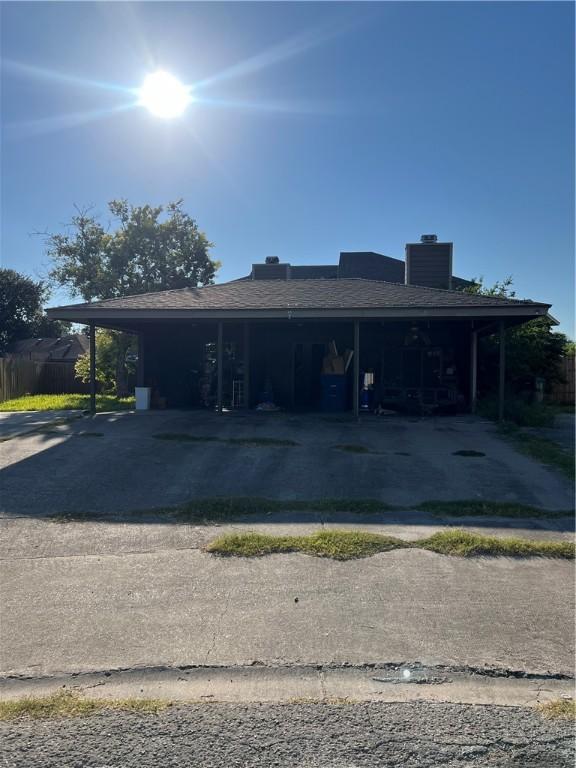 view of front facade with a carport