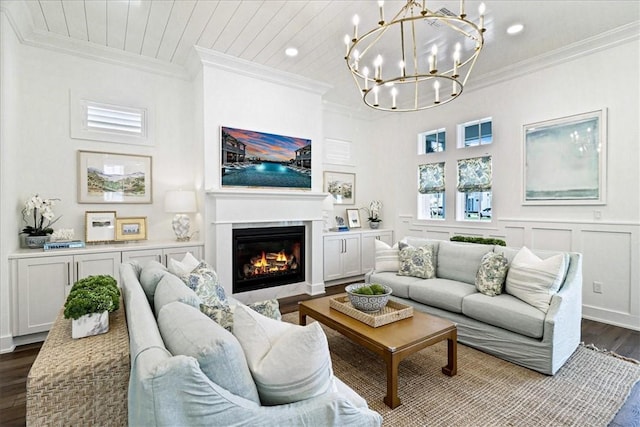 251 Laughter Ln, Port Aransas, TX 78373 - living room featuring dark wood-style floors, a chandelier, a glass covered fireplace, ornamental molding, and recessed lighting
