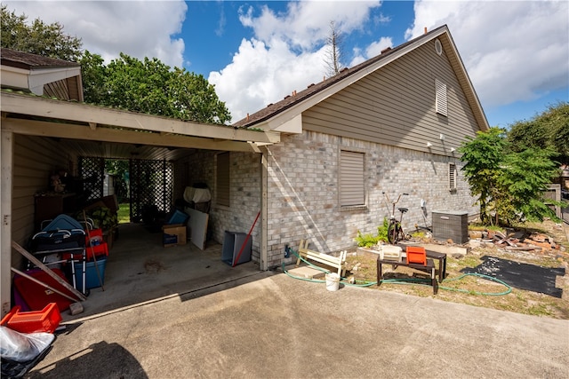 view of home's exterior featuring a carport